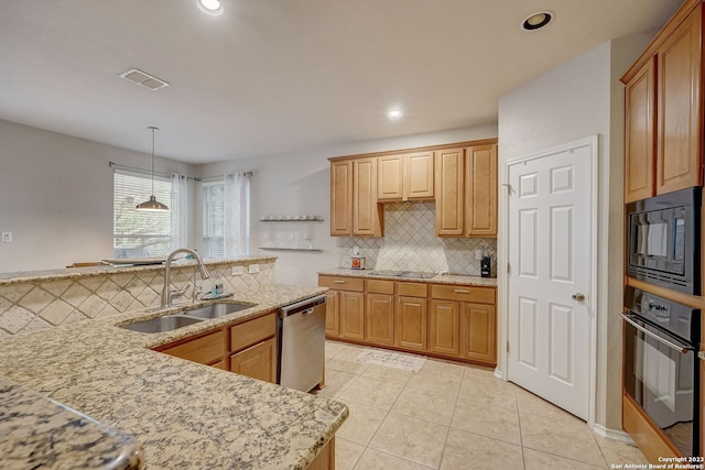 kitchen with light stone countertops, a sink, backsplash, visible vents, and black appliances