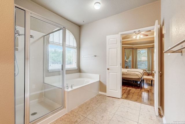 3234 Bending Crk, San Antonio, TX 78261 - ensuite bathroom featuring plenty of natural light, a shower stall, a garden tub, and connected bathroom