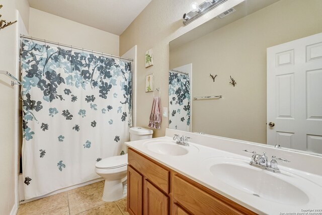 3234 Bending Crk, San Antonio, TX 78261 - full bathroom with a sink, toilet, double vanity, and visible vents