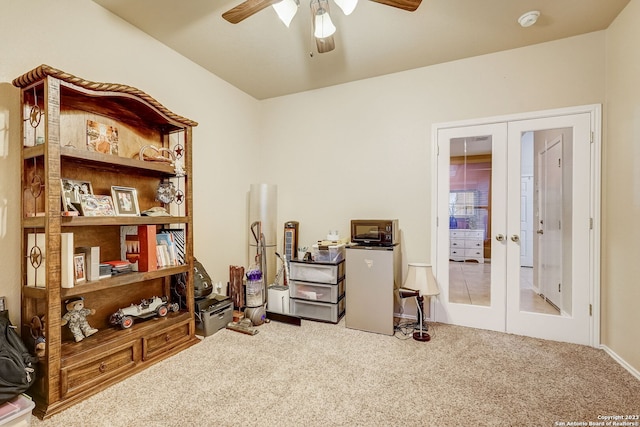 interior space with a ceiling fan, french doors, and carpet flooring