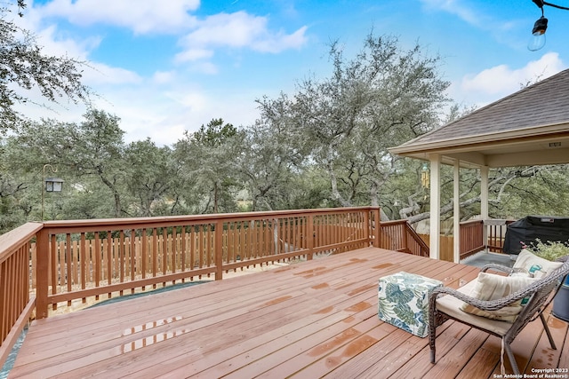 wooden terrace with area for grilling