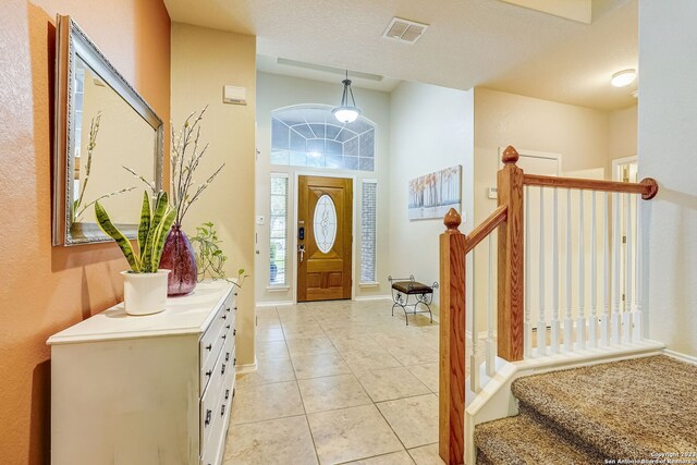 3234 Bending Crk, San Antonio, TX 78261 - entrance foyer featuring light tile patterned floors, baseboards, stairs, and visible vents