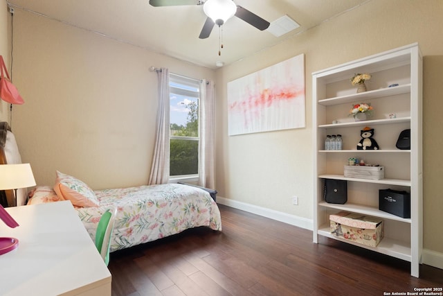 bedroom featuring baseboards, a ceiling fan, and hardwood / wood-style flooring