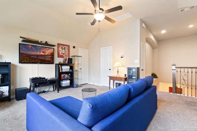 carpeted living area featuring visible vents, a ceiling fan, baseboards, and lofted ceiling