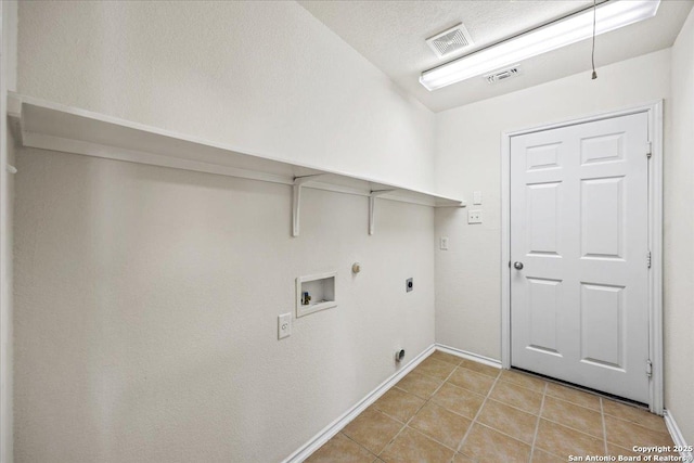 laundry room featuring laundry area, hookup for a washing machine, light tile patterned flooring, and visible vents