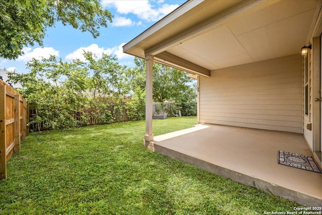 view of yard with a fenced backyard and a patio area