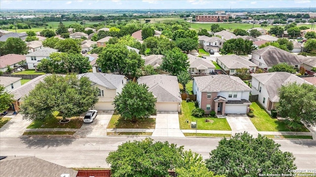 birds eye view of property with a residential view