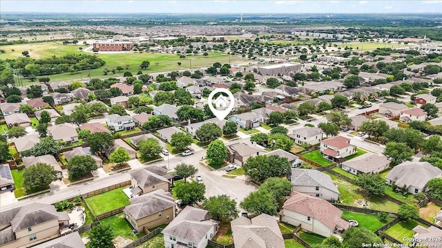 birds eye view of property with a residential view