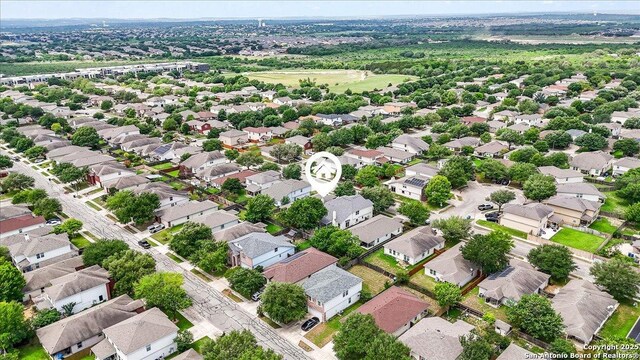 birds eye view of property with a residential view