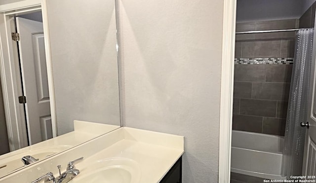 bathroom featuring shower / tub combo with curtain and vanity