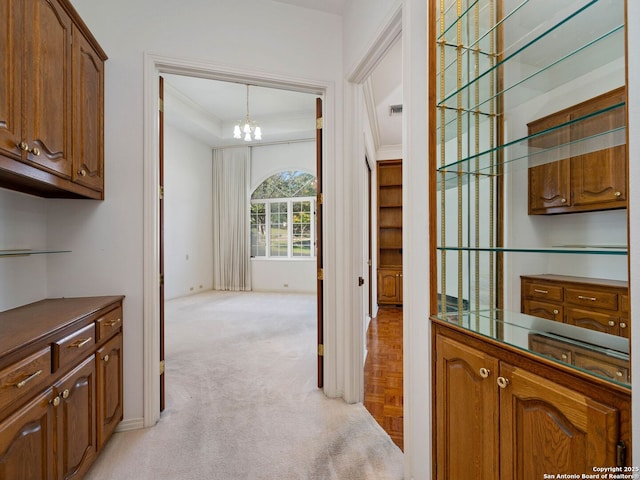 9 Chester Downs, San Antonio, TX 78257 - bar featuring light colored carpet, an inviting chandelier, baseboards, visible vents, and ornamental molding