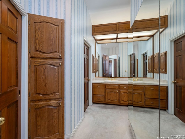 9 Chester Downs, San Antonio, TX 78257 - bathroom featuring wallpapered walls and vanity
