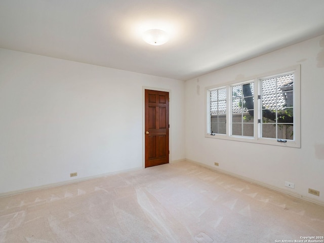 9 Chester Downs, San Antonio, TX 78257 - empty room with baseboards and light carpet