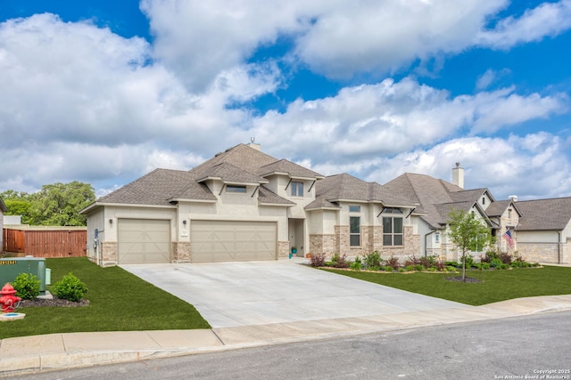 view of front of property featuring fence, an attached garage, a front lawn, stucco siding, and driveway