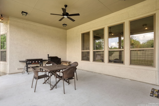 view of patio / terrace with outdoor dining area and a ceiling fan