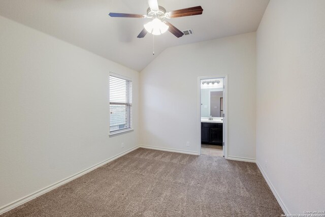 empty room with ceiling fan, light carpet, baseboards, lofted ceiling, and visible vents