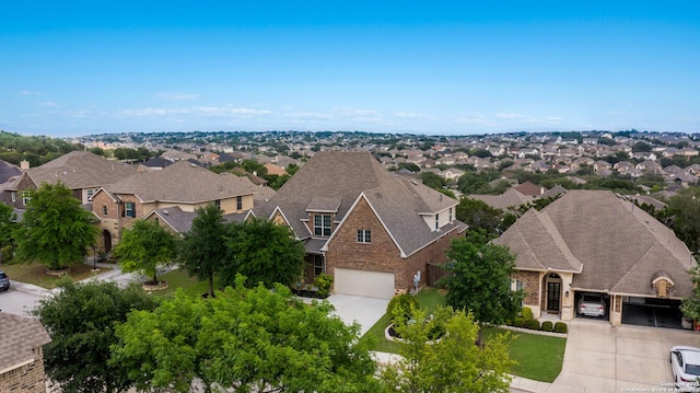 birds eye view of property with a residential view