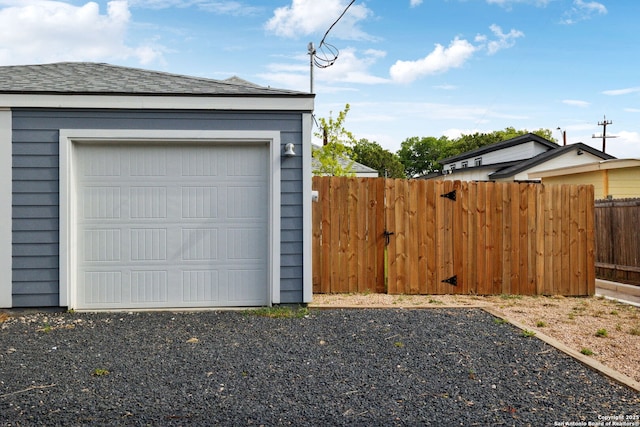 garage featuring fence