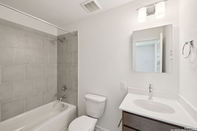 full bathroom featuring toilet, visible vents, tub / shower combination, and vanity