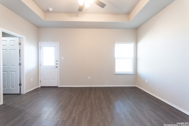 3436-3438 Scott Cir, Seguin, TX 78155 - unfurnished room with a tray ceiling, baseboards, a ceiling fan, and dark wood-type flooring
