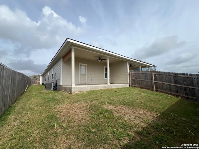 3436-3438 Scott Cir, Seguin, TX 78155 - back of house featuring a lawn, a fenced backyard, ceiling fan, and central AC unit