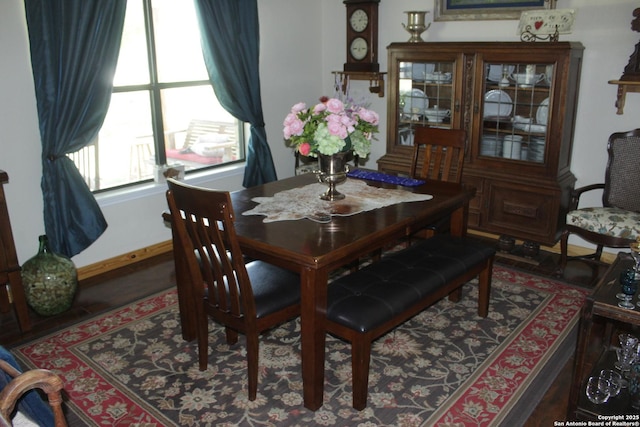dining area featuring baseboards