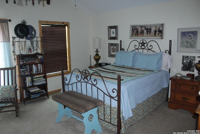 bedroom with carpet and lofted ceiling