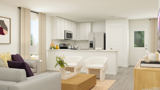 kitchen featuring light wood-style floors, range, white cabinetry, stainless steel microwave, and fridge with ice dispenser