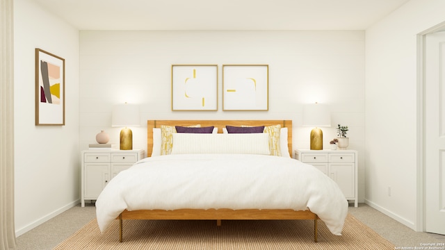 bedroom with baseboards and light carpet