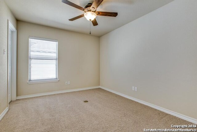 17739 Via Del Oro, San Antonio, TX 78257 - unfurnished room featuring baseboards, ceiling fan, and light colored carpet