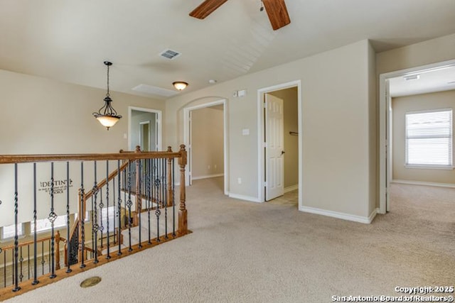 17739 Via Del Oro, San Antonio, TX 78257 - hall with baseboards, visible vents, carpet flooring, and an upstairs landing