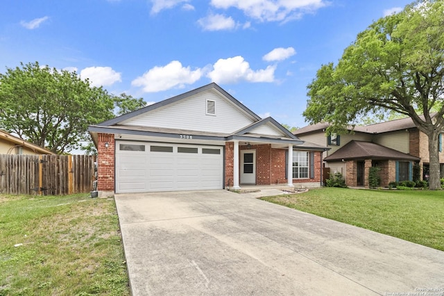 single story home featuring fence, an attached garage, driveway, and brick siding