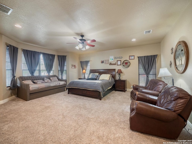 bedroom featuring carpet floors, ceiling fan, baseboards, and visible vents