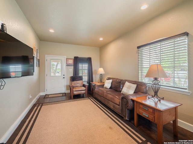 living room with recessed lighting, baseboards, and a wealth of natural light