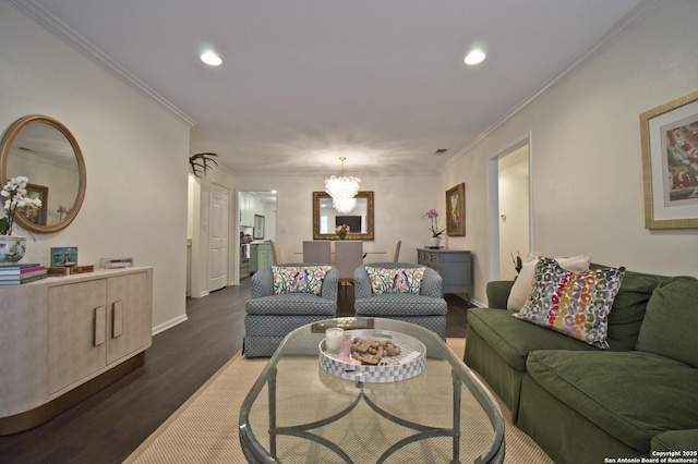 living area with recessed lighting, ornamental molding, a notable chandelier, and dark wood-style floors