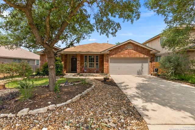 ranch-style house featuring concrete driveway, brick siding, and a garage