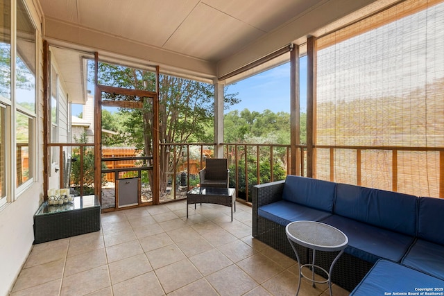 sunroom featuring outdoor lounge area