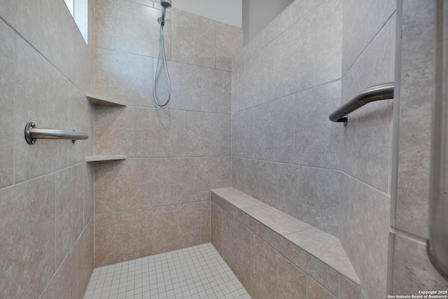 full bathroom with a tile shower