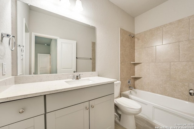 11922 Tower Crk, San Antonio, TX 78253 - bathroom featuring shower / bath combination, wood finished floors, vanity, toilet, and a textured wall