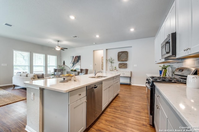 11922 Tower Crk, San Antonio, TX 78253 - kitchen with a ceiling fan, visible vents, appliances with stainless steel finishes, wood finished floors, and a sink
