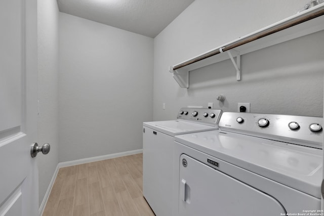 11922 Tower Crk, San Antonio, TX 78253 - washroom with laundry area, washing machine and dryer, baseboards, and light wood finished floors