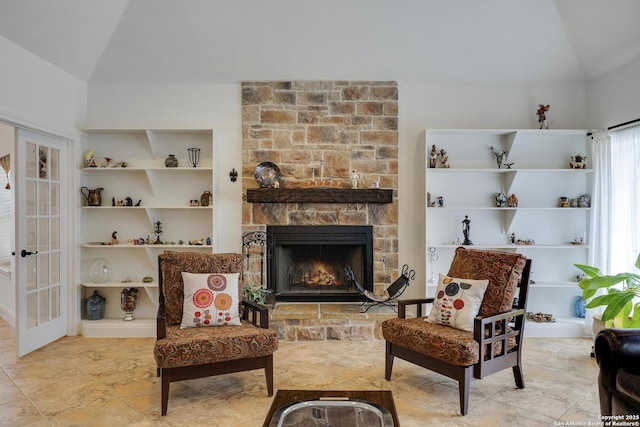 16812 Fox Rdg, Helotes, TX 78023 - sitting room featuring a stone fireplace and vaulted ceiling
