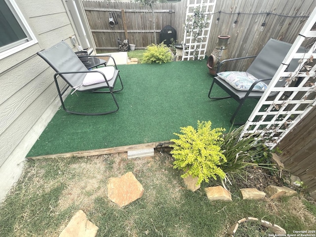 view of patio featuring fence