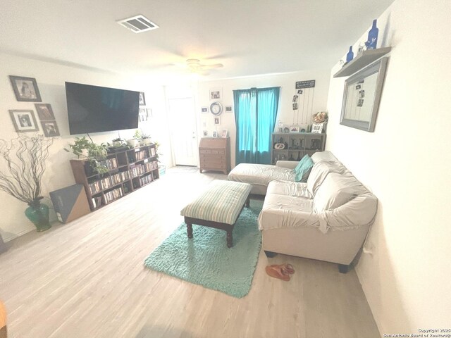20430 Onyx Ring, San Antonio, TX 78264 - living room featuring visible vents, ceiling fan, and wood finished floors