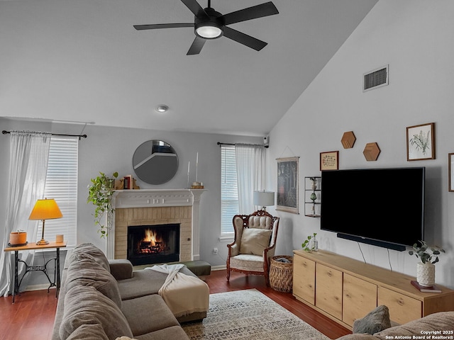 51 Roan, San Antonio, TX 78259 - living room with ceiling fan, a brick fireplace, wood finished floors, and visible vents