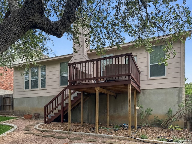 51 Roan, San Antonio, TX 78259 - rear view of house with stairway, fence, and a wooden deck