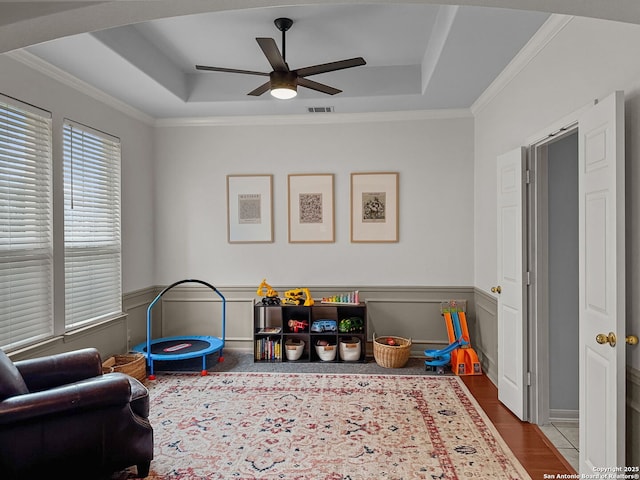 51 Roan, San Antonio, TX 78259 - rec room with crown molding, a ceiling fan, a tray ceiling, and wood finished floors