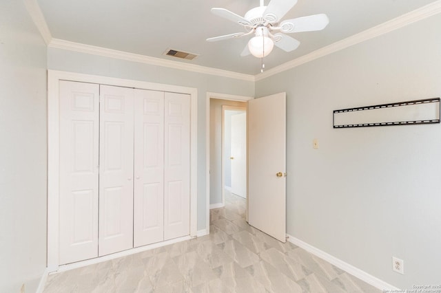 unfurnished bedroom featuring a ceiling fan, visible vents, crown molding, baseboards, and a closet