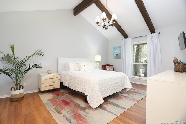 bedroom featuring an inviting chandelier, vaulted ceiling with beams, and wood finished floors