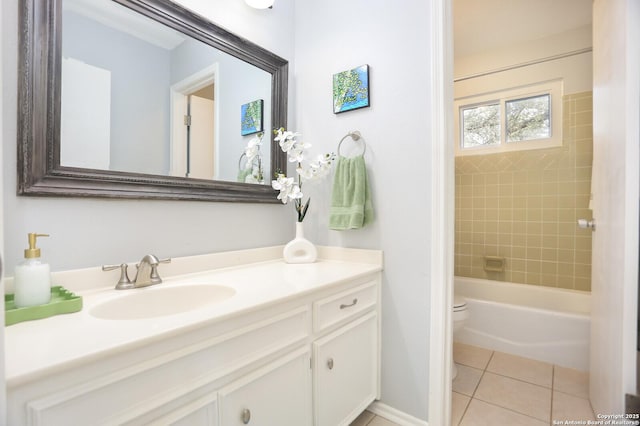 bathroom featuring vanity, tile patterned floors, and toilet